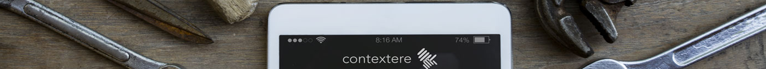 'what it does' section header image - picture of a phone on a table surrounded with tools